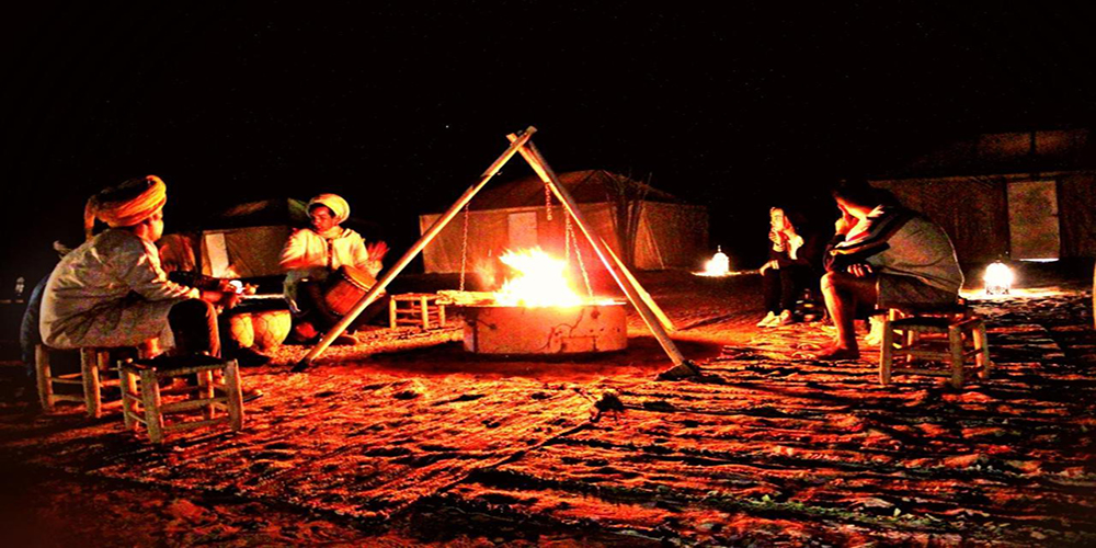 Music around a fire in the desert of Merzouga – zagora desert